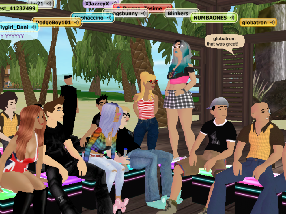 Globatron the famous YouTuber who helped make the virtual world There.com popular sits with friends at a karaoke event. 